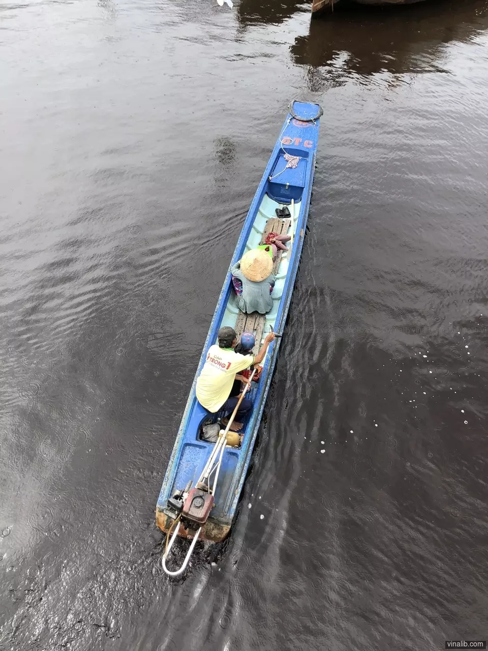Bird view of a boat in the Mekong Delta - Vinalib Stock Pictures