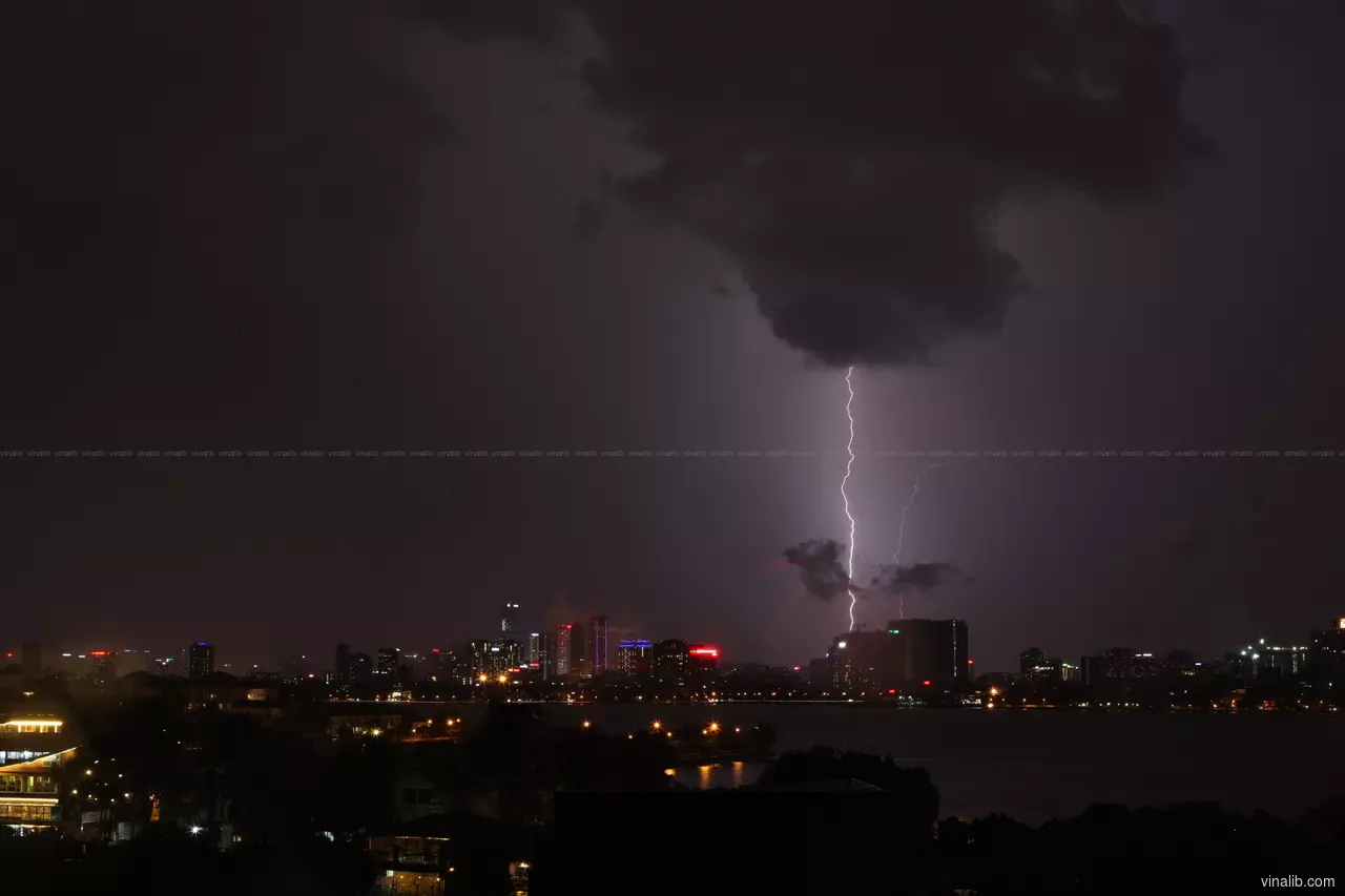 A lightning strike in West Lake, Hanoi - Vinalib Stock Pictures