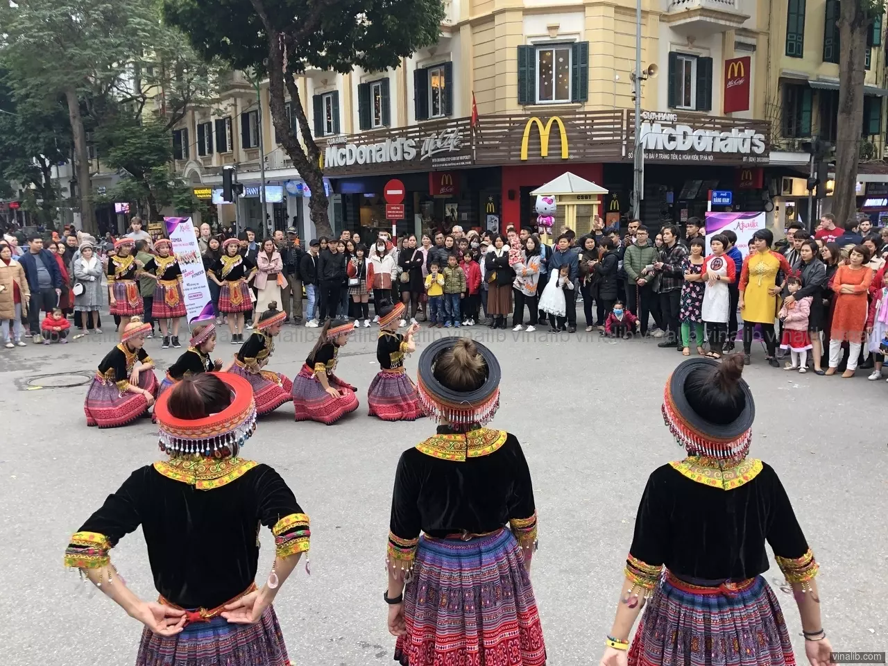 H'Mong style zumba dance promotion in front of a McDonalds in Hanoi, Vietnam - Vinalib Stock Pictures