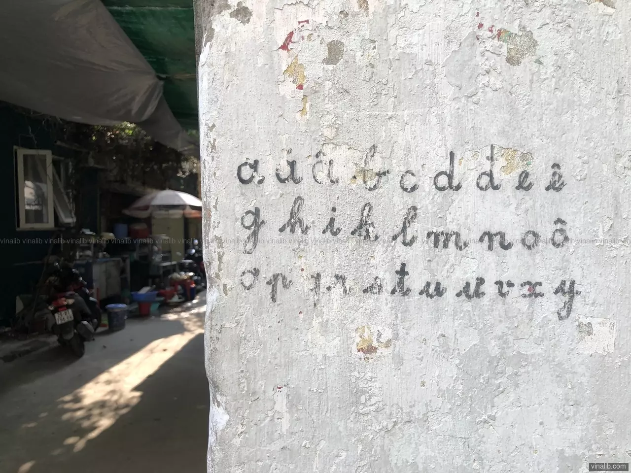 The Vietnamese alphabet, handwritten on a wall in a lane off Kim Ma street, Ngoc Khanh, Ba Dinh, Hanoi.